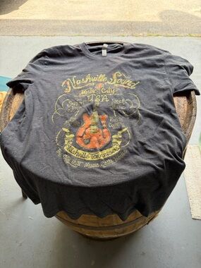 Next Level Apparel Black Tee with Orange Guitar Graphic